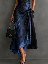 Rosalia | Vestido midi cruzado con estampado abstracto, escote en V, manga corta, cinturón y bajo asimétrico con volante