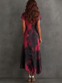 Rosalia | Vestido midi cruzado con estampado abstracto, escote en V, manga corta, cinturón y bajo asimétrico con volante