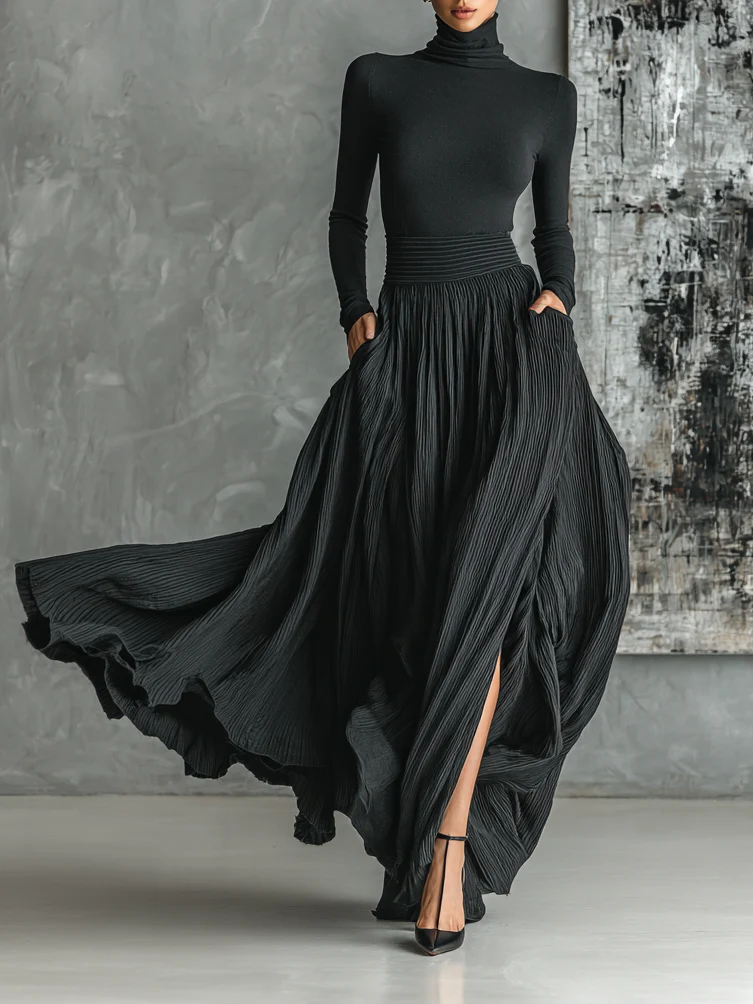 Rachele | Conjunto negro con falda plisada y jersey de manga larga