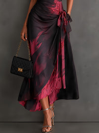 Rosalia | Vestido midi cruzado con estampado abstracto, escote en V, manga corta, cinturón y bajo asimétrico con volante